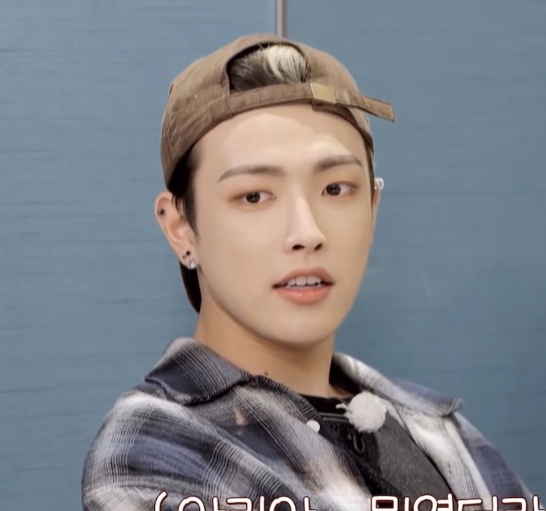 the genre is hongjoong wearing his hat backwards