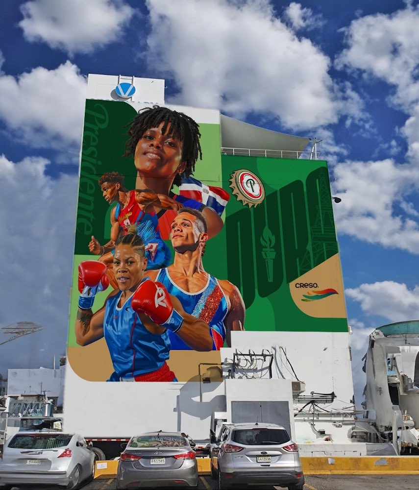 Los que ya vieron el mural de la Gustavo con Lope de Vega que pintó Angurria, deben imaginarse que los Juegos Olímpicos de Paris ya están al doblar de la esquina. Es por eso que Cerveza Presidente, para celebrar que por primera vez tendremos nuestra “Casa de la Dominicanidad” en