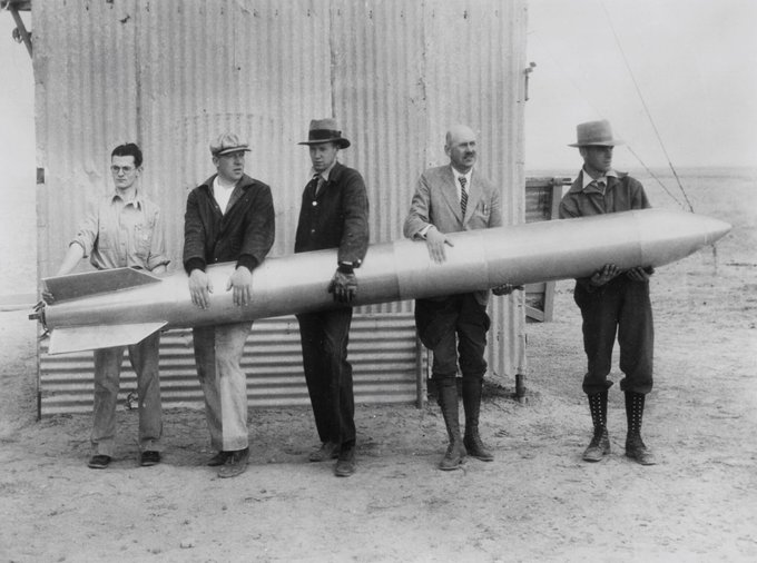 Dr. Robert Goddard and colleagues holding the Rocket used in flight of April 19, 1932. They are from left to right, L. Mansur; A Kisk; C. Mansur; Dr. Robert Goddard; and N.L. Jungquist.