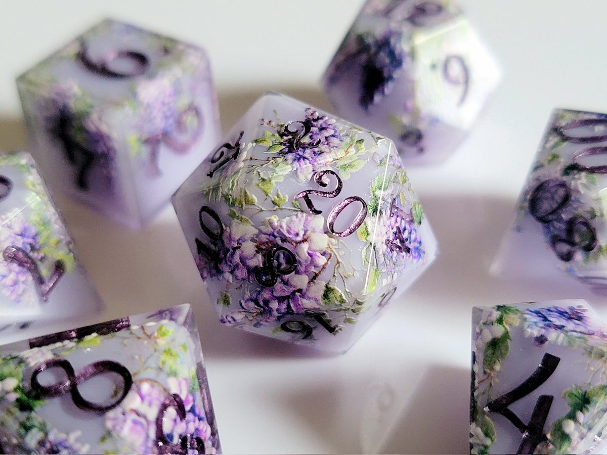 ForbiddenFae's tweet photo. "Wisteria" sets and D20s will be restocked when our shop updates on Saturday, July 6th, at 12pm PT! https://t.co/oa8yVFaWZQ