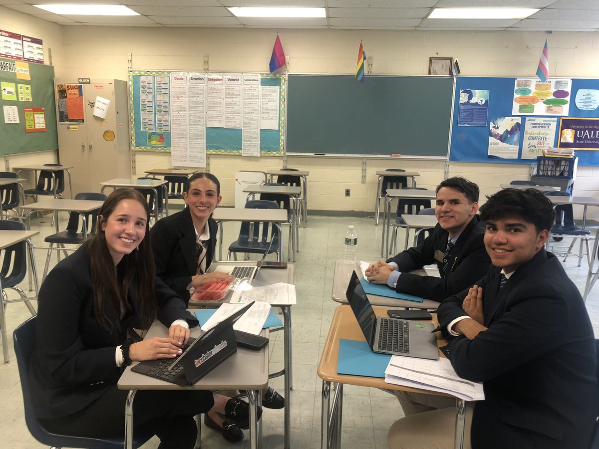 Team 65 working on their Program of Work for the 2024-2025 year.