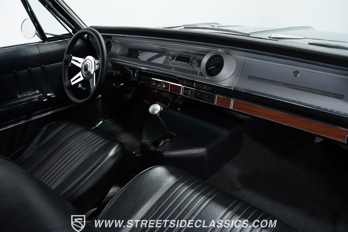 This 1965 #Chevrolet #Impala #Restomod features a 6.0L #V8 LQ4 teamed with a 4-speed automatic transmission with overdrive. See more of this car here: streetsideclassics.com/vehicles/4556-…