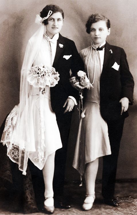 Two women dressed as bride and groom at the same time. Photographed in the 1920s.