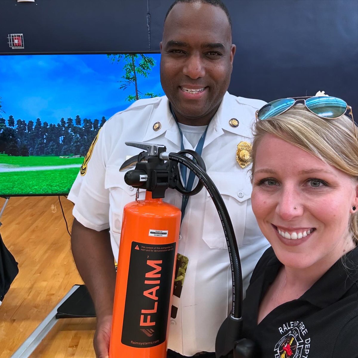 DrCheveralls's tweet photo. After a year with @raleighncfire they’re finally letting me put out (virtual) fires 🔥 Having a blast helping Lt Hubbard show off our new VR Fire Extinguisher Prop at the @RaleighGov Big Ideas 💡 City Connect Series today. https://t.co/YscR0yJuG6