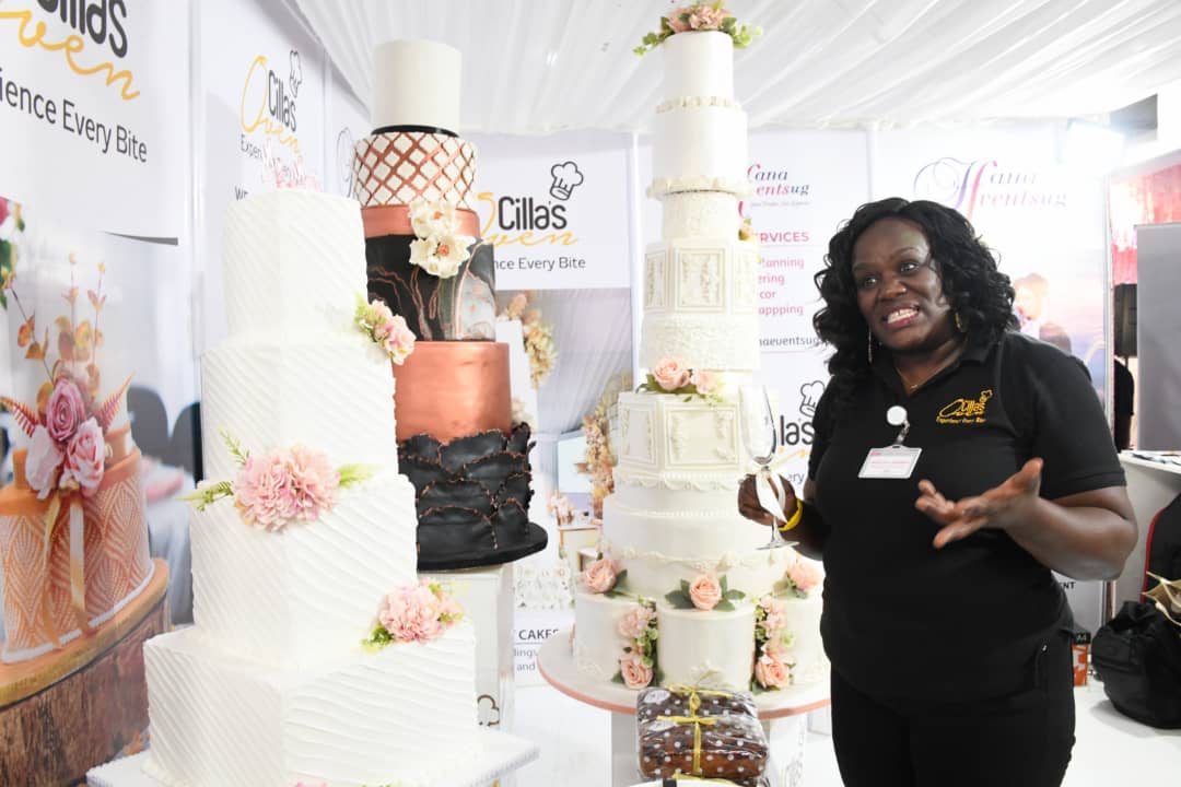 VisionGroup's tweet photo. Wow! Priscilla Anne Mugerwa, Managing Director of Cilla's Oven, displaying her stunning cakes at #BrideAndGroomExpo. https://t.co/ExdhyI9BFG