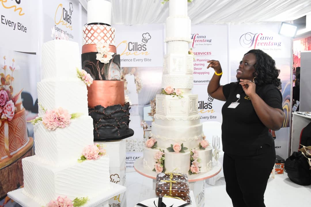 VisionGroup's tweet photo. Wow! Priscilla Anne Mugerwa, Managing Director of Cilla's Oven, displaying her stunning cakes at #BrideAndGroomExpo. https://t.co/ExdhyI9BFG