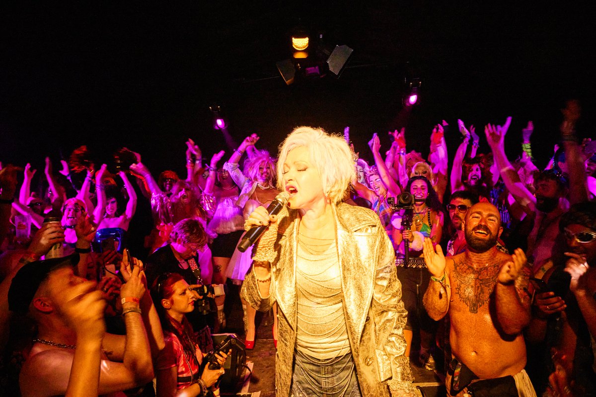consequence's tweet photo. Cyndi Lauper played a surprise performance at Glastonbury's nightclub NYC Downlow to celebrate Gay Pride on Saturday. She was joined on stage by more than 20 drag queens, kings, and gogo dancers hailing from across the globe.

Photo credit: Martin Perry https://t.co/mWshLpts58