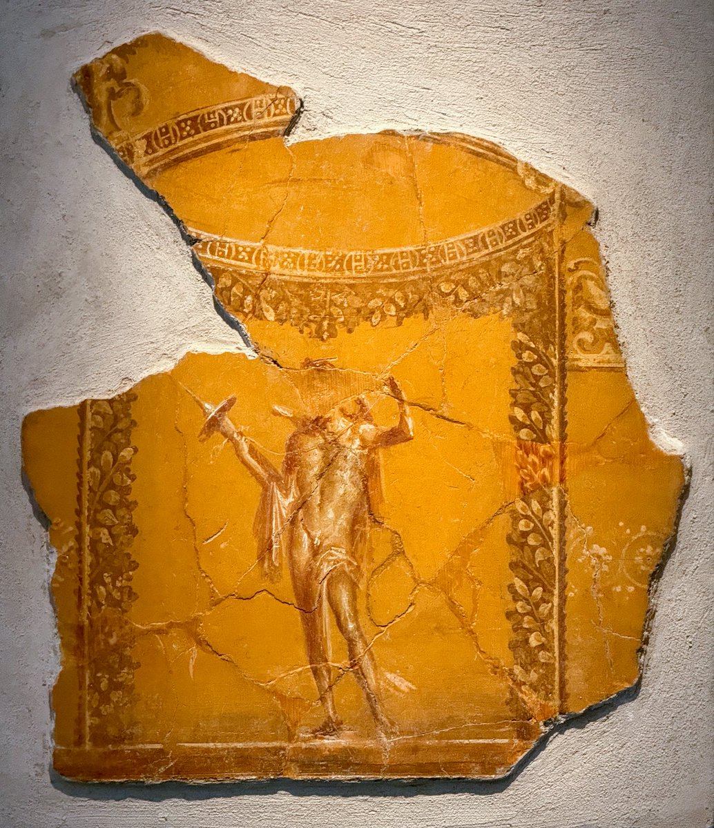 chapps's tweet photo. OK, this one is baffling. The fresco fragment below - I know, gorgeous - from the Villa Arianna in Stabiae is labeled as Apollo in an aedicula with bow and arrow. But are those wings on his back? And that looks like a torch.

50-79 CE. Stabia Archaeological Museum (63843).

📸 me https://t.co/InFr7IiVjQ