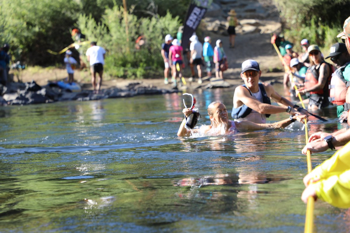Local resident Emily Hawgood gets lots of cheers as she crosses the American River at mile 78 in third. She’s totally with it and looks like she can still roll. She’s 54 minutes off the lead. #WS100