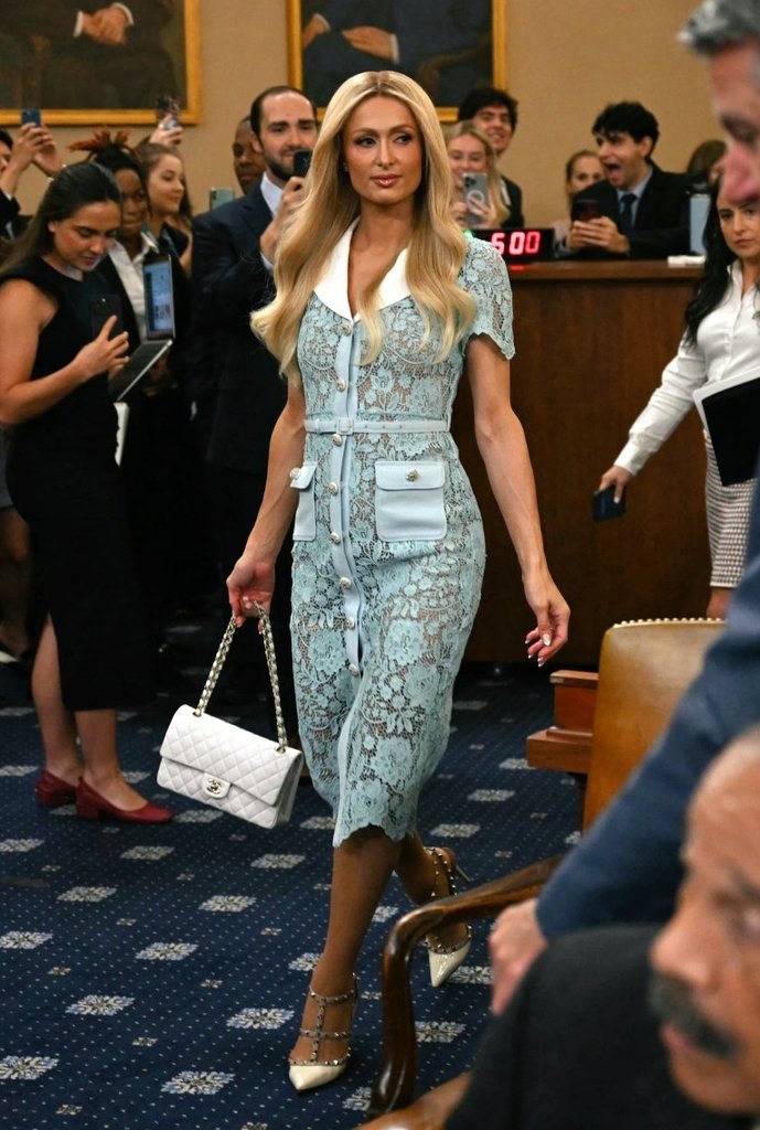 Paris Hilton donned in SELF-PORTRAIT blue lace midi dress ,a white CHANEL bag and VALENTINO pumps as she testifies for Stronger child welfare protection for Foster Youth at the US house committee Paris Hilton donned in SELF-PORTRAIT blue lace midi dress ,a white CHANEL bag and VALENTINO pumps as she testifies for Stronger child welfare protection for Foster Youth at the US house committee
