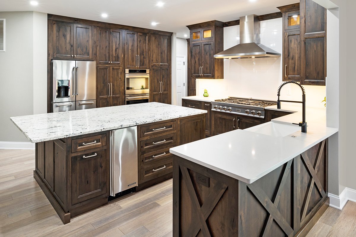Step into warmth with a well-designed rustic alder kitchen, bathed in a rich Tawny stain!  <a href="/Showplace_Cab/">Showplace Cabinetry</a> Edgewater door | Rustic Alder | Tawny