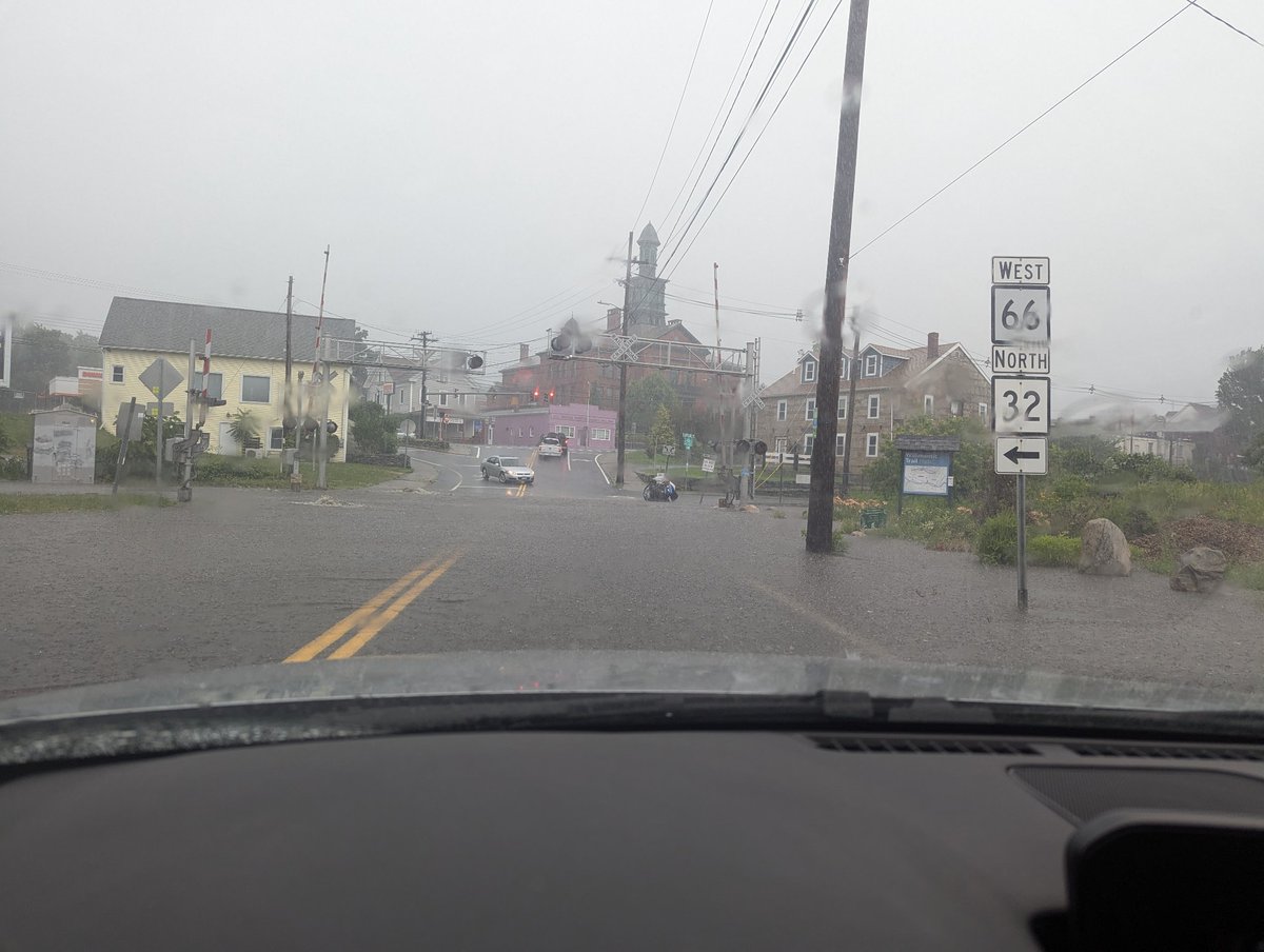 Capessergal's tweet photo. @NWSBoston flooding in Willimantic on Bridge Street just before Main around 2:33 pm, a vehicle got stuck shortly after I took this picture https://t.co/Xb4RNd783a