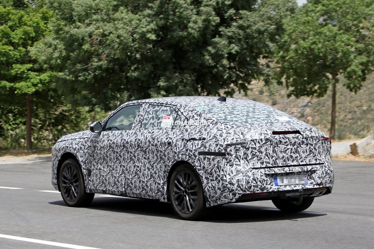 cole_marzen's tweet photo. The 2025 DS 8 Crossback reveals its high-quality cabin in our latest batch of spy photos. From what we can see, the fastback will feature a unique four-spoke steering wheel, a fully-digital instrument cluster, as well as a large center touchscreen display. #DS #DS8Crossback #BEVs https://t.co/X9Q5LCYtWf