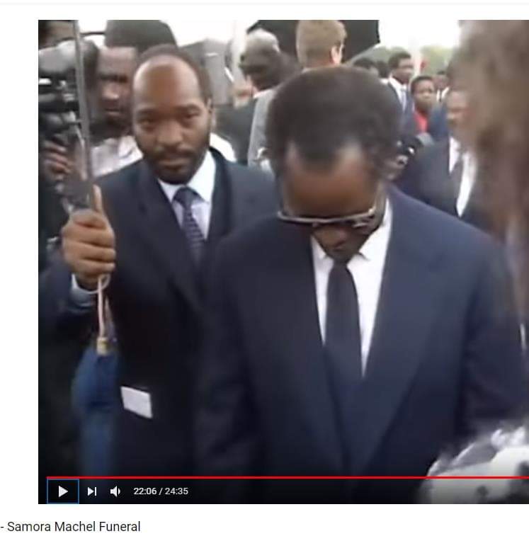 Jacob Zuma holding  an umbrella for then ANC president Oliver Tambo during the funeral of Samora Machel in Maputo, October 28, 1986.