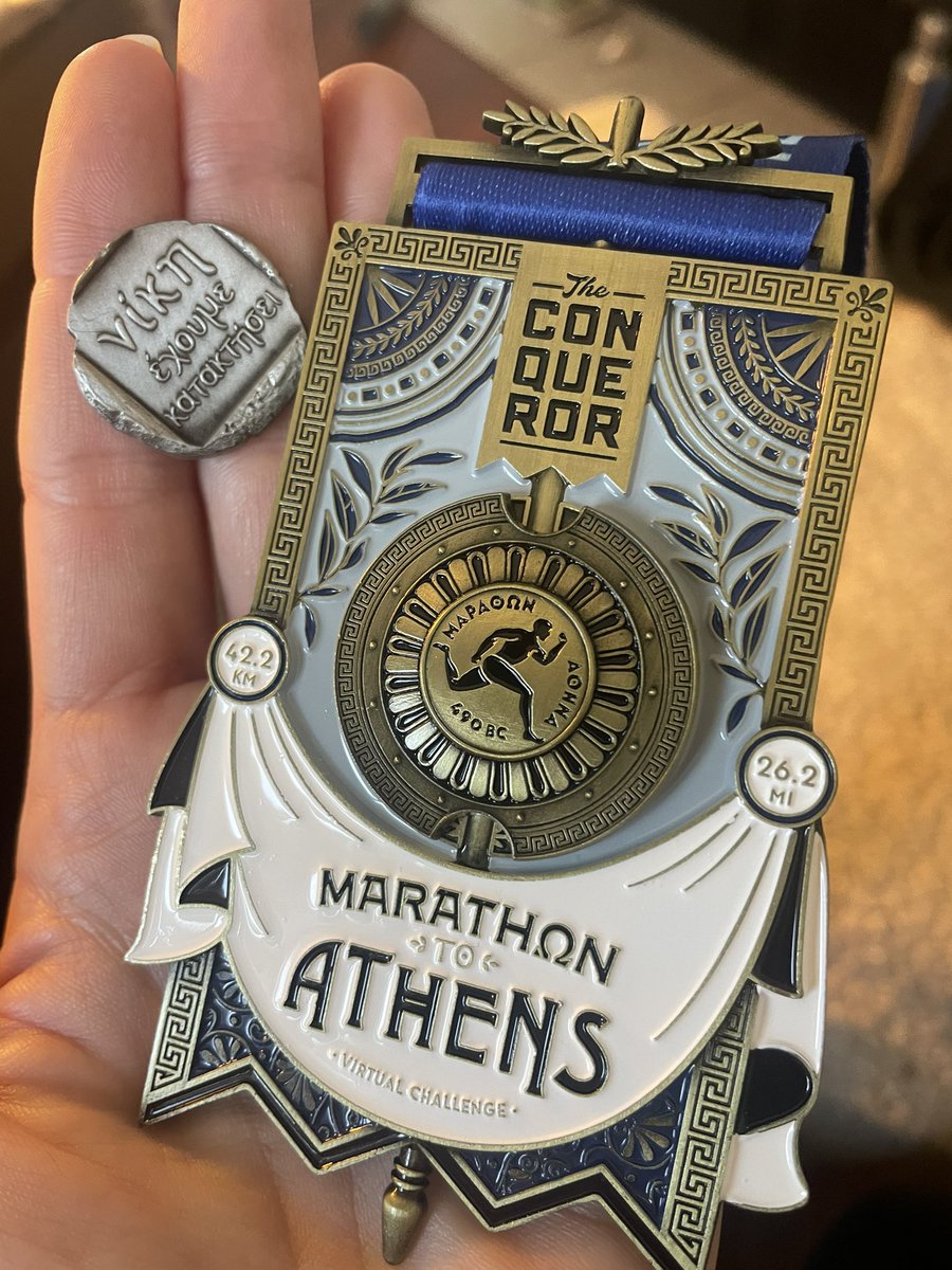 JennaBusch's tweet photo. Got my marathon to Athens medal from #theconquerorchallenge! I did it in two days (I have a full marathon on 8/4) and the medal is ... so freaking beautiful! Tiny coin inside that says "we have won" in Greek and I was able to read it myself! I WILL do the real #Athensmarathon! https://t.co/nTGrvMxsfO
