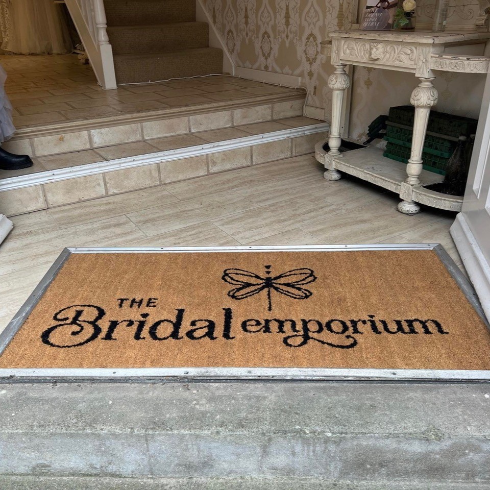 Step into elegance and make a grand entrance! ✨ Our beautiful custom logo mat sets the perfect stage for this Bridal shop.  Let your brand shine with a doormat that speaks volumes.💐 #BritishDoormats #CustomLogoMat #BridalShopEntrance