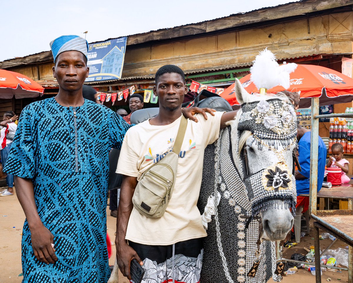 Ojude Oba - Not Alone 

A horse-groomer and his friend strike a pose by the side of a decorated horse during the Ojude Oba festival in Ijebu Ode. 

Ogun State, Nigeria.