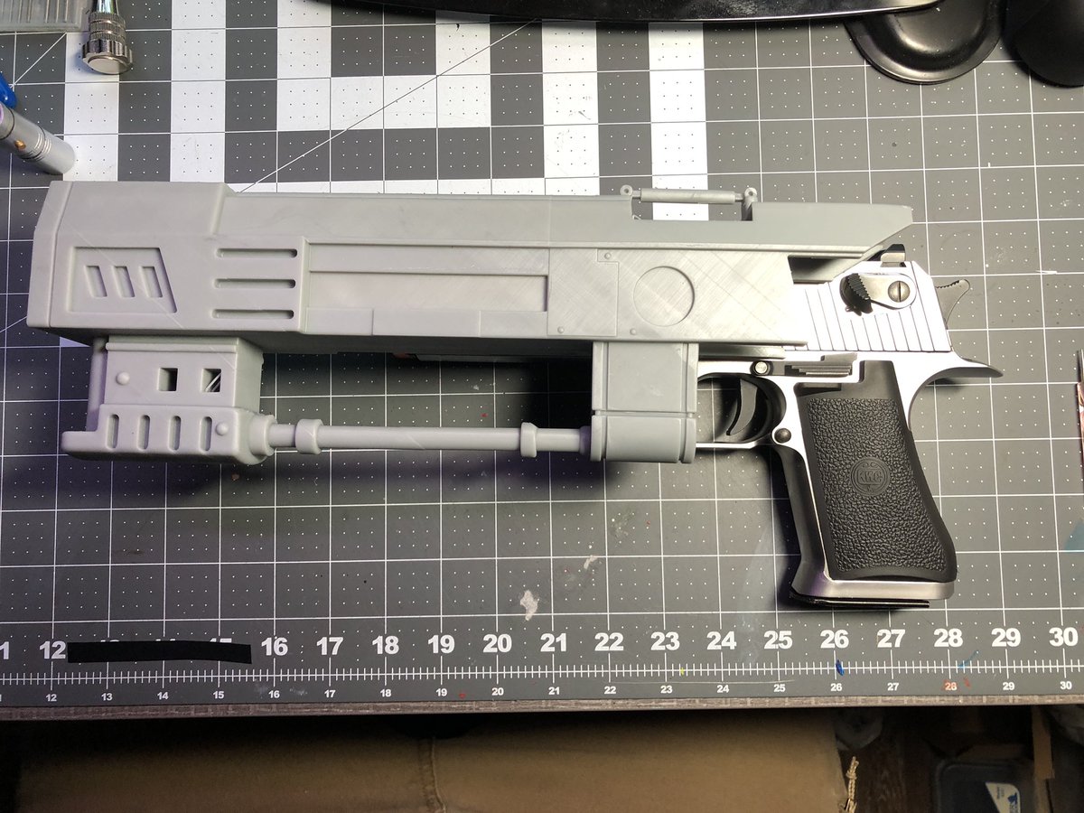 GeekToyLove's tweet photo. #printerbounty, finally getting g around to doing a T-60 pistol from #Fallout. I picked up an Airsoft base model second hand off eBay and printed the barrel extension last night. 

Will need to do some fitting still, hoping to retain most of the functionality and then paint https://t.co/WZmFxK0SMy