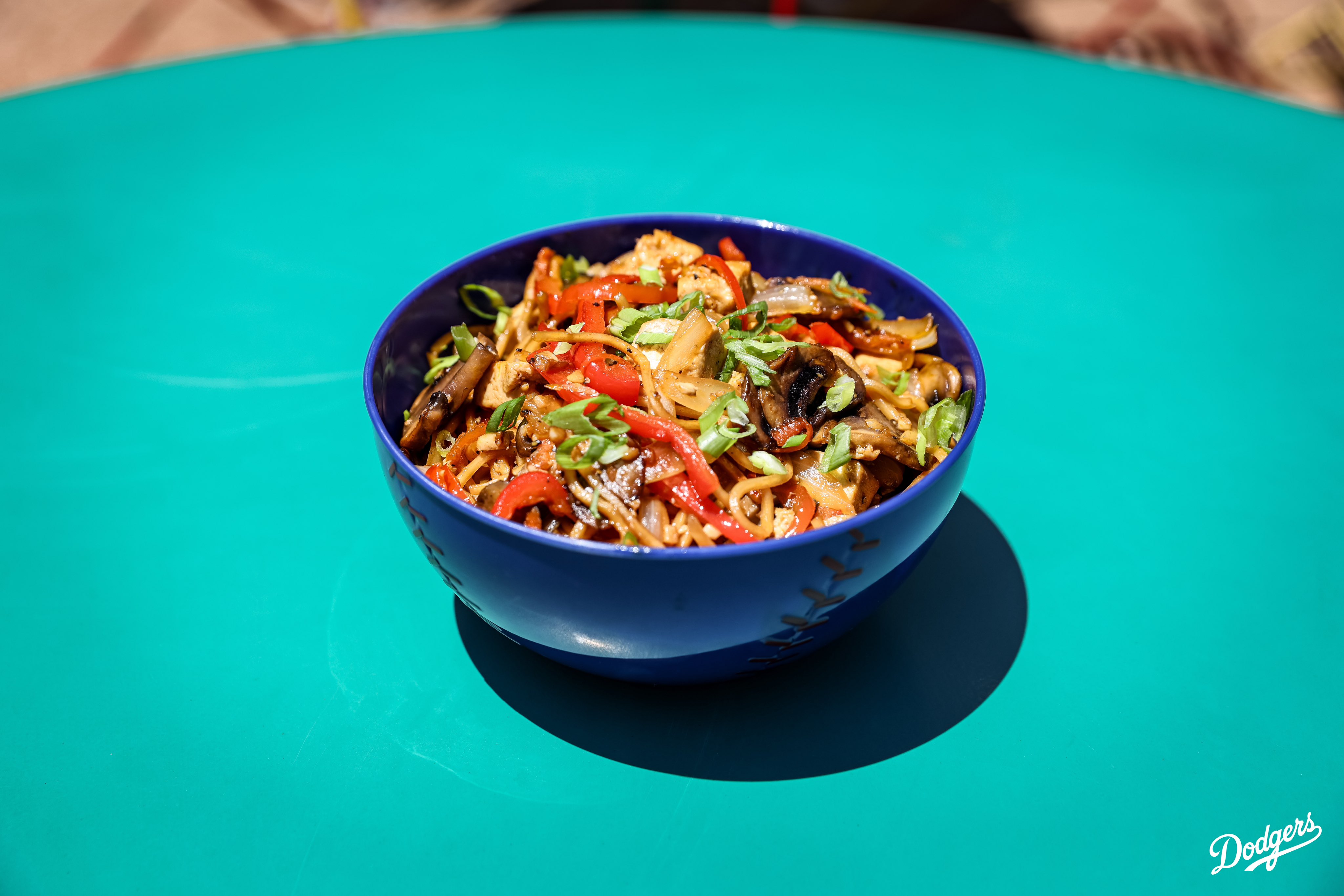 A photo of a Yaki Udon Bowl. 

Here’s where you can find all the food items: 
•Takoyaki: Field 45⁣
•Chicken Katsu Sandwich: Field 8⁣
•Homerun Platter: Field 8⁣
•Kurobuta Pork Terimayo Dog: Field 8, LA Feeds Blue (next to Gold Glove), Reserve 4⁣
•Chef Merito Ponzu Asada Fries: Field 52, Reserve 17⁣
•Tofu Yakisoba Bowl: Field 45⁣
•Chicken Katsu Curry Bowl: Field 45, Reserve 4⁣
•Mochi Ice Cream: Field 8, LA Feeds Blue (next to Gold Glove)⁣