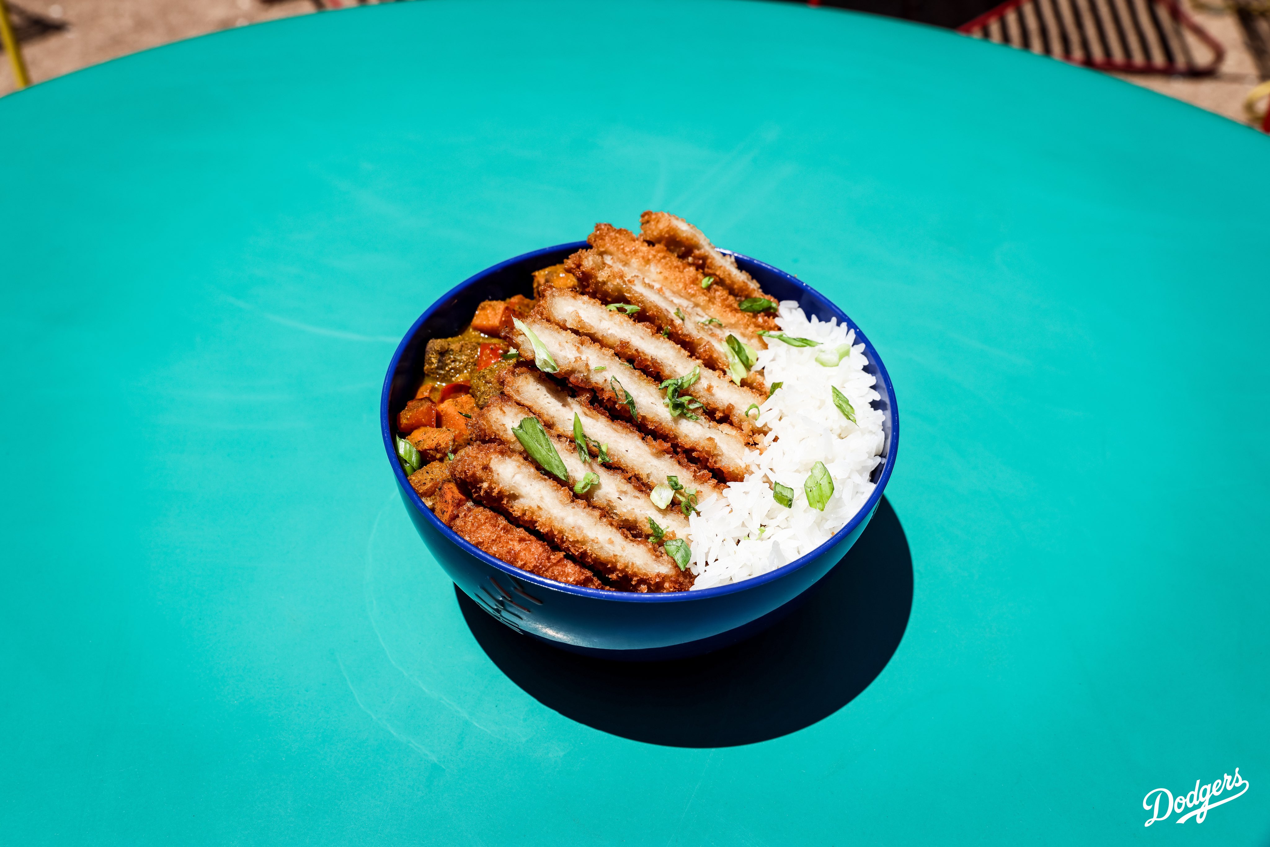 A photo of a Japanese Chicken Curry Bowl. 

Here’s where you can find all the food items: 
•Takoyaki: Field 45⁣
•Chicken Katsu Sandwich: Field 8⁣
•Homerun Platter: Field 8⁣
•Kurobuta Pork Terimayo Dog: Field 8, LA Feeds Blue (next to Gold Glove), Reserve 4⁣
•Chef Merito Ponzu Asada Fries: Field 52, Reserve 17⁣
•Tofu Yakisoba Bowl: Field 45⁣
•Chicken Katsu Curry Bowl: Field 45, Reserve 4⁣
•Mochi Ice Cream: Field 8, LA Feeds Blue (next to Gold Glove)⁣