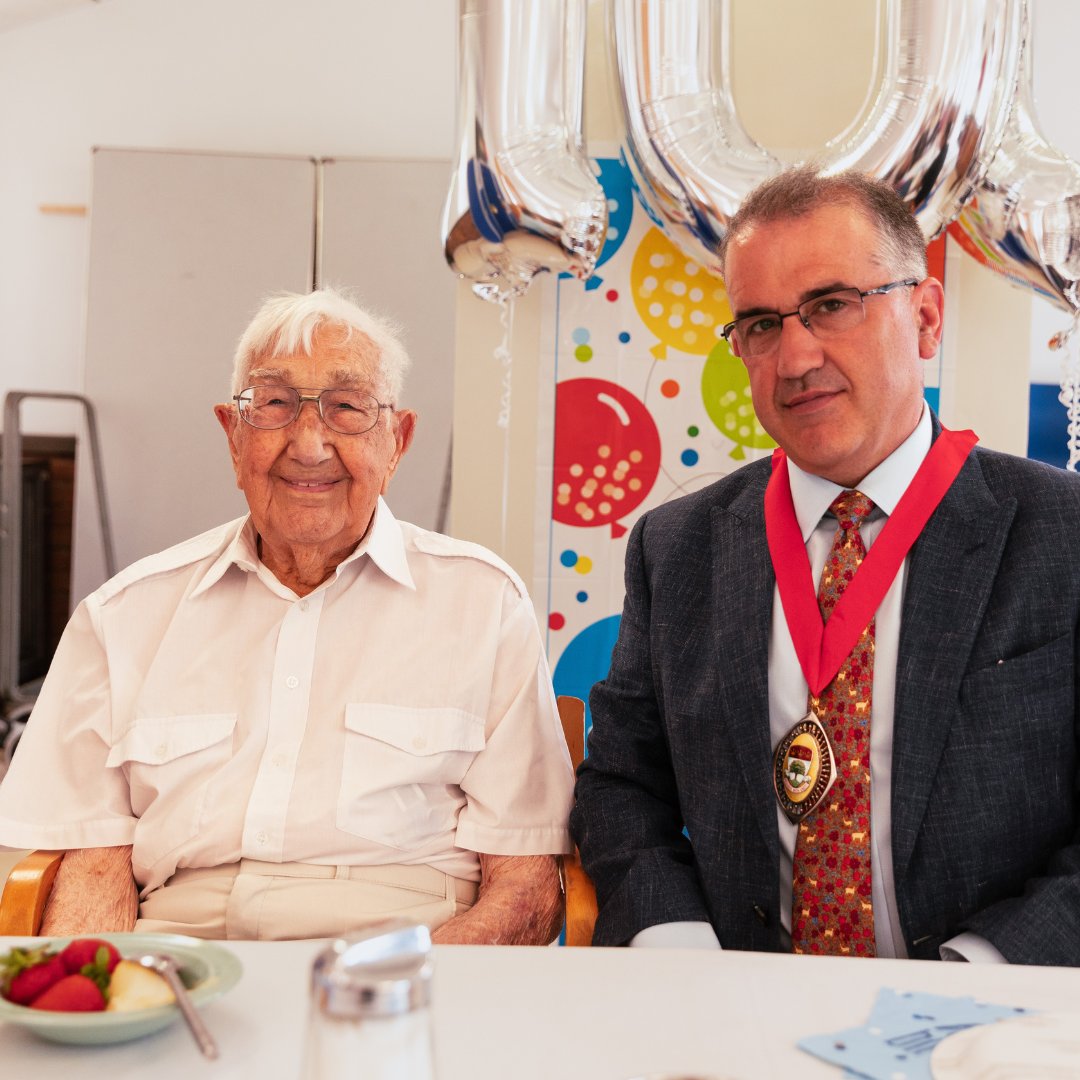 AgeUKEaling's tweet photo. Last week, we had a great time celebrating the 100th birthday of Charlie Hatfield, a long-time visitor of our @ageuk #Ealing Wellbeing Day Centre. Charlie's son Malcolm – a recently retired @ECT_Charity driver – and our Day Centre Managers Jan and Carolyn organised a fab party🎉 https://t.co/CmDBbFCyCj