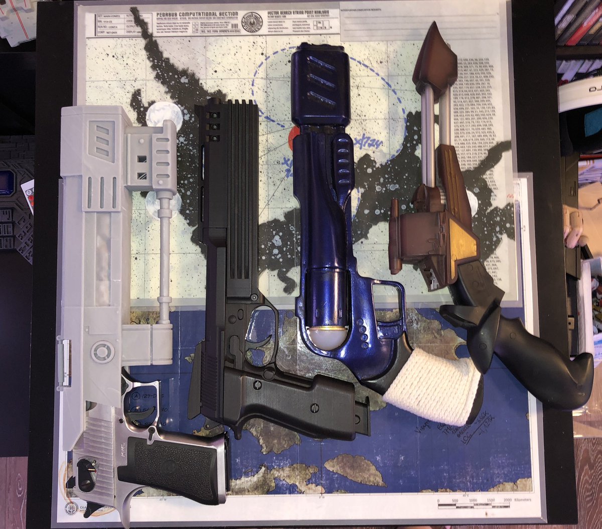 GeekToyLove's tweet photo. This T-60 from #Fallout is massive!! Here in comparison with some of the other oversized blaster replicas in the #GeekDen Armory https://t.co/4n9bH8bQsA