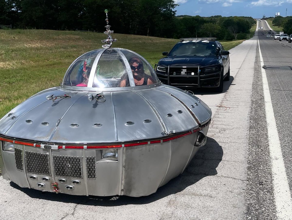 OHPDPS's tweet image. It's not every day you pull over a UFO. Trooper Ryan Vanvleck #722 pulled over this vehicle on the Turner Turnpike yesterday for an obstructed tag. They were on their way to a UFO festival in Roswell, New Mexico. Trooper Vanvleck let them go with a warning.