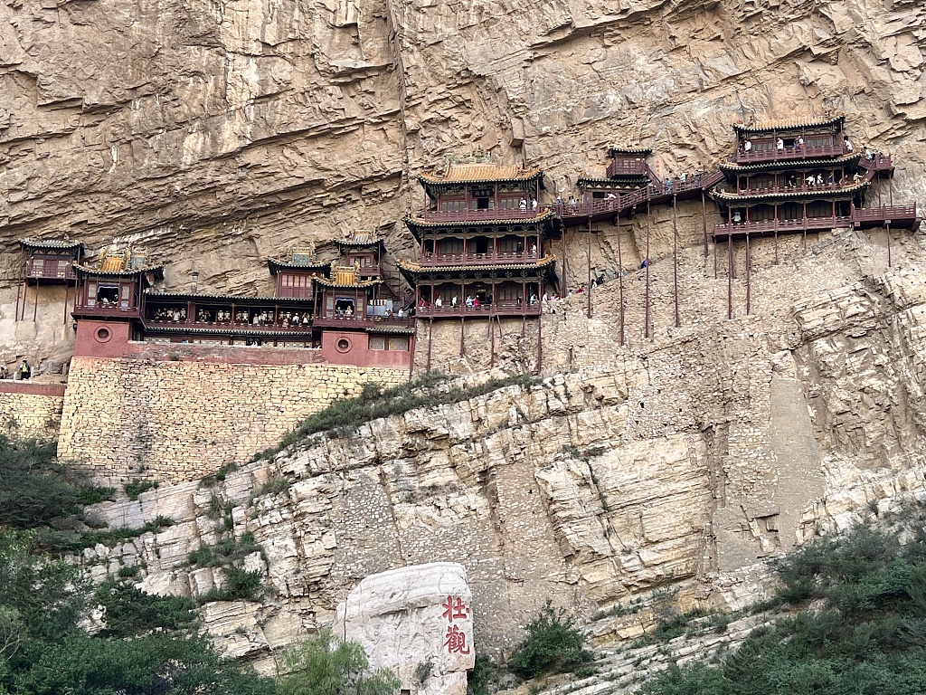CGTNOfficial's tweet photo. The Hanging Temple in Datong City, north China's Shanxi Province, was built over 1,500 years ago, and suspended on the cliffs of Hengshan Mountain, about 50 meters above the ground. The Hanging Temple is a truly amazing feat of engineering and one of the world's forgotten wonders.

The whole temple has a wooden frame structure. Its position is well chosen, with rocks above blocking rainfall, and mountains on both sides blocking wind. It's also high enough to avoid damp and rot from flooding. #ChinaUpClose #ExploreShanxi