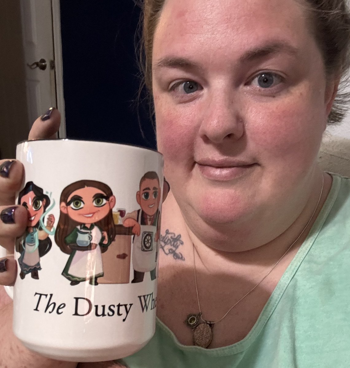 Drinking iced tea out of my <a href="/thedustywheel/">The Dusty Wheel Inn of The Wheel of Time</a> mug (yes technically  <a href="/ThePoetSloth/">Sean the Gleeman</a> won it but I collect mugs so it’s mine💜 so excited for #WoTIdol