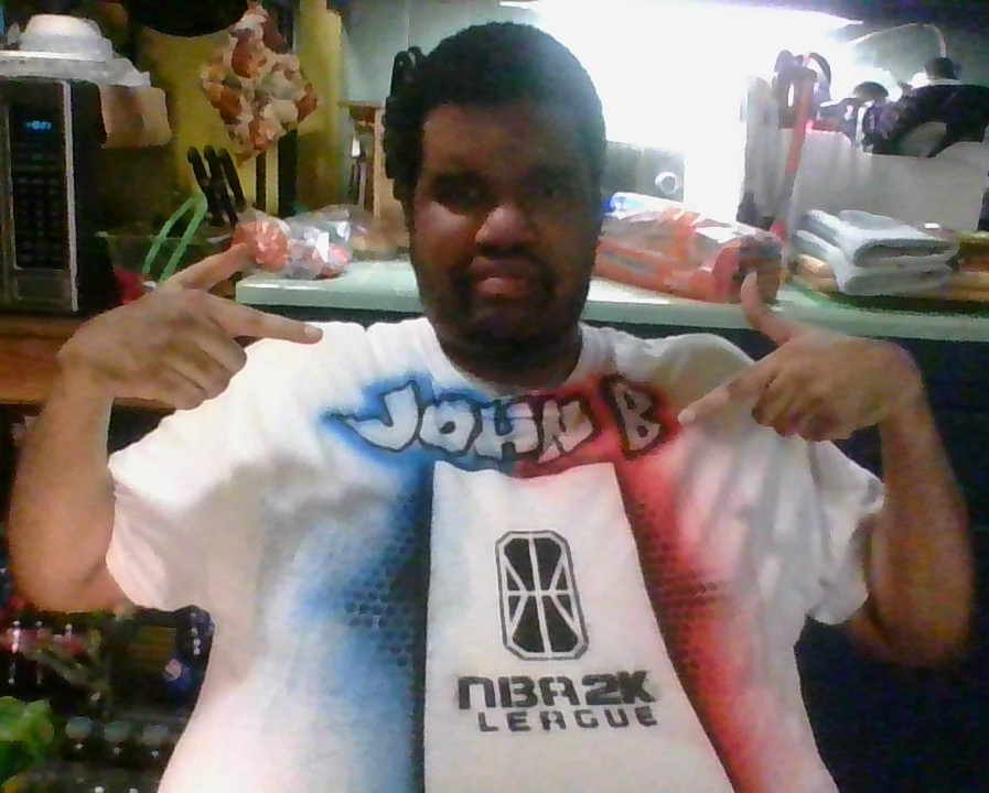 johnbmarine's tweet photo. Though this custom NBA2K League XL-size shirt is short for me, I decided to model it and show my thanks to the NBA2K League for their love and support. Thank you! #LetsGo2KL https://t.co/Nyt5iE0zR3