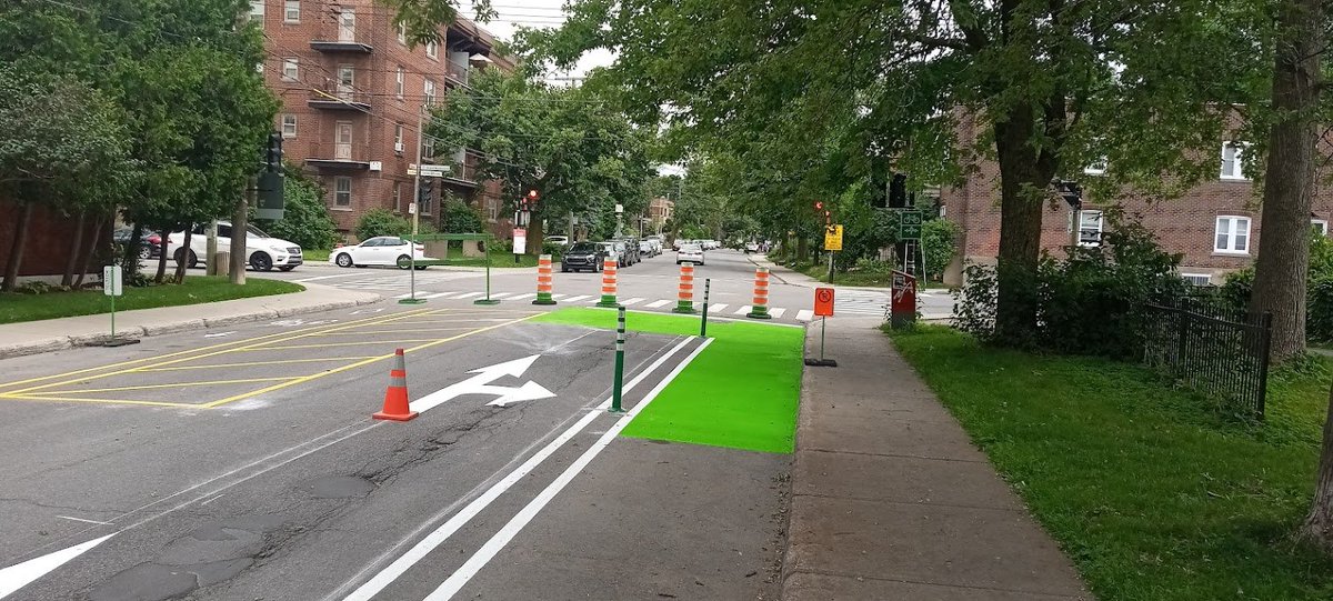VeloNDG's tweet photo. Sassy 🙂The new Terrebonne bike path at the corner of Grand. To explain the play on words; this green box is actually called a "sas vélo" where cyclists can safely wait in front of cars to turn left in this case and connect to the Grand bike path. https://t.co/r5szutOkmM