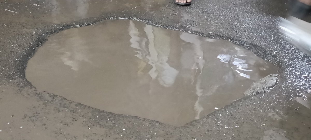 A dangerous pothole is on the Safety Tank Near Shiv Sena Shakha 193 and in front of Raj Kamal Saloon. The bikers are driving their bikes sideways of it. Dangerous to anyone falling from the bikes especially ladies and children.Done only cleaning after 1 month of complaint.