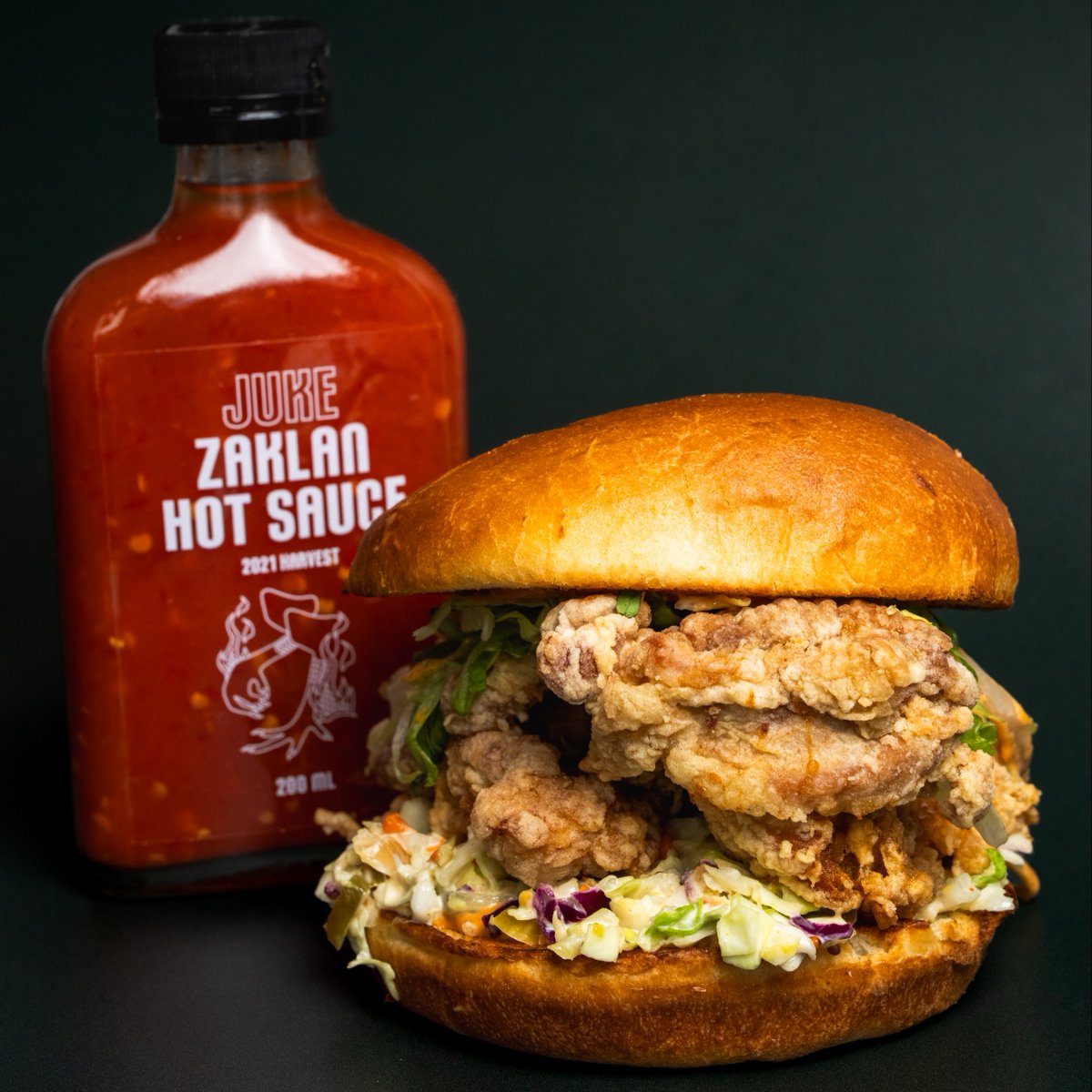 July 6th is International Fried Chicken Day! 🍗🎉 

Celebrate with Juke Fried Chicken's unbeatable deal: half-priced chicken sandwiches from 11 AM to 6 PM (limit of 5 per person).

Plus, the first 30 guests get a free bottle of our exclusive Zaklan x Juke Hot Sauce Collab. 🔥