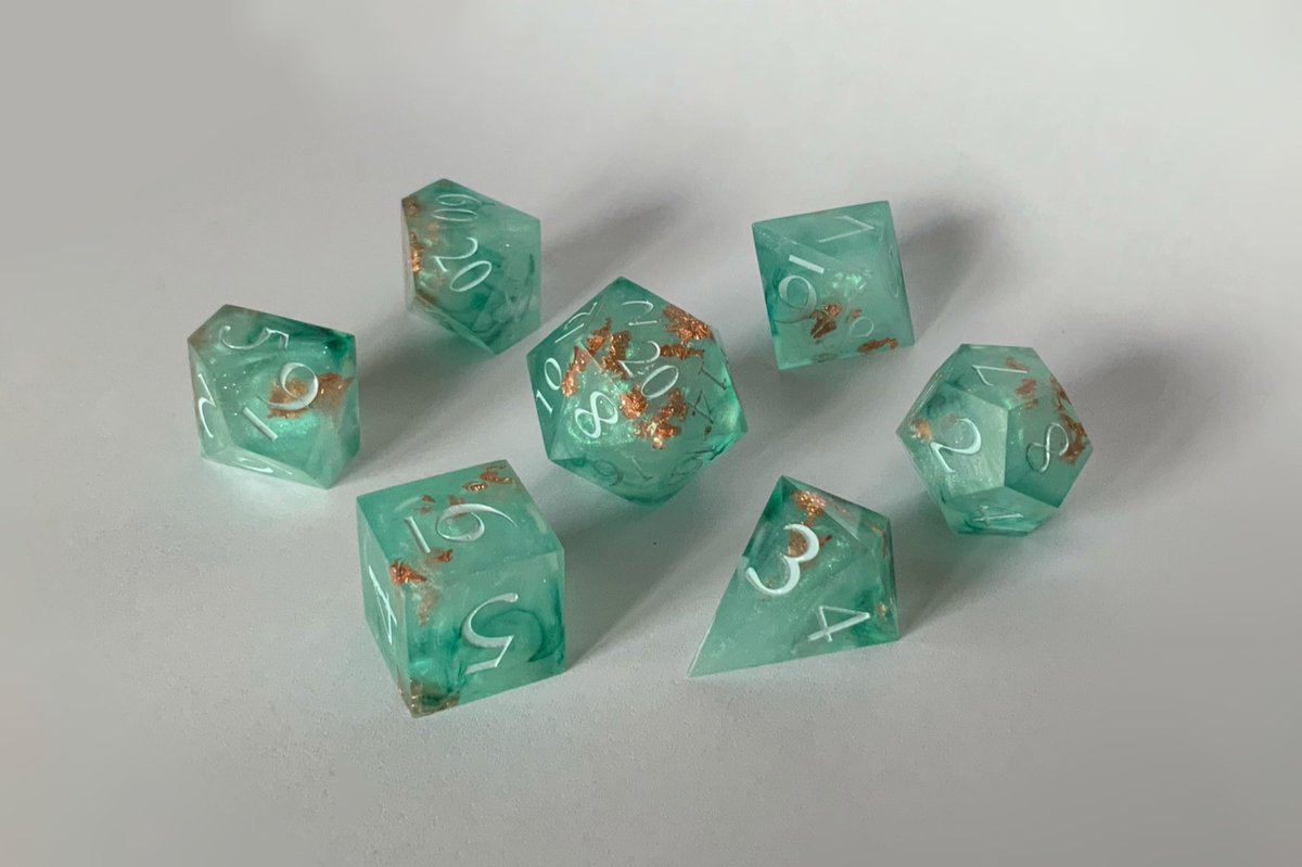 3rdcaster's tweet photo. Turquoise dice set

#ttrpg #dnd #dice #handmadedice https://t.co/6cmvHsR4vv