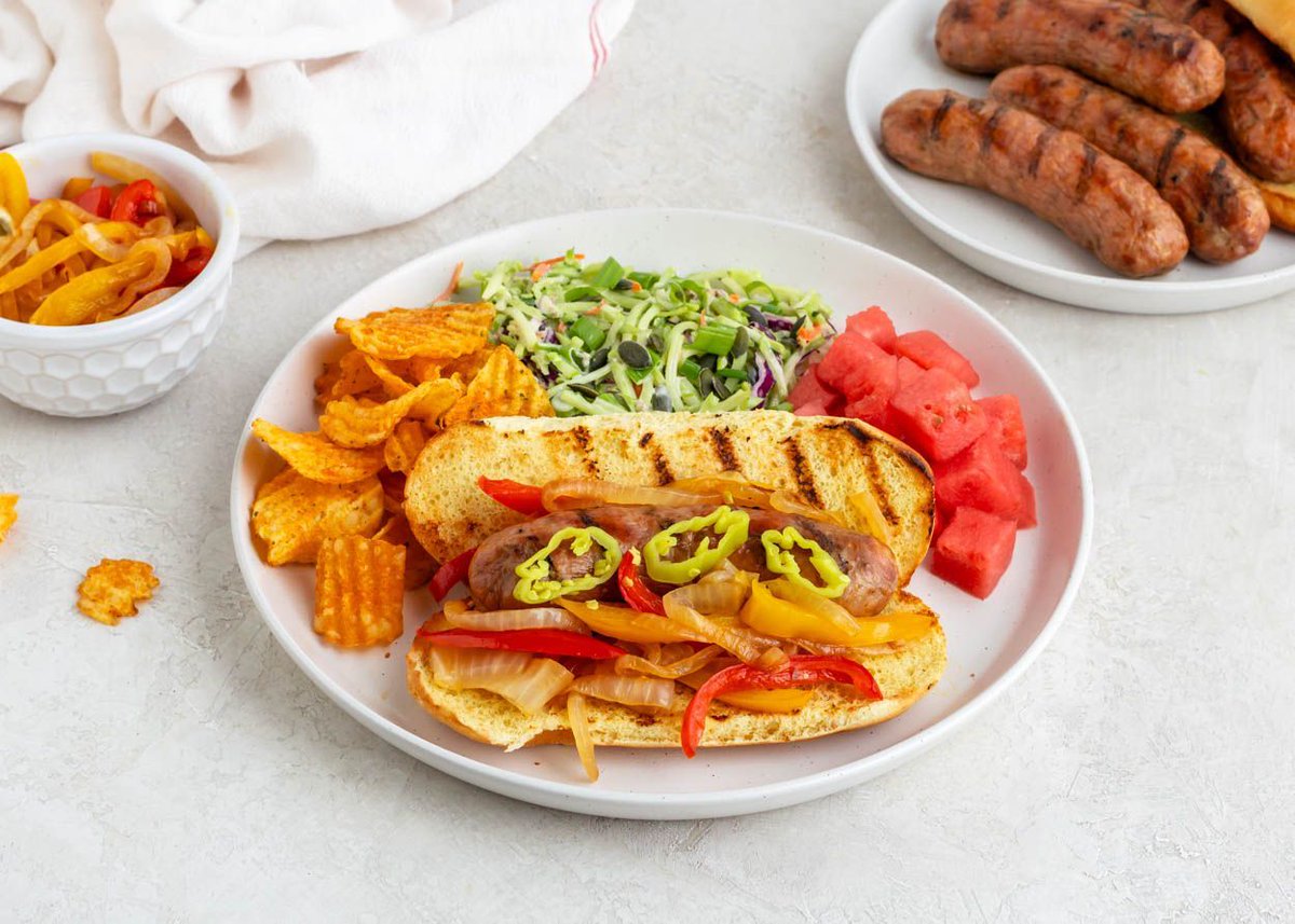 Sausage Dogs with Peppers and Onions | These elevated sausage dogs are a great choice for a backyard barbecue, a camp cookout, or a weeknight dinner at home.  Happy (kitchen) Independence Day! | buff.ly/3VAItQE #mealplan
