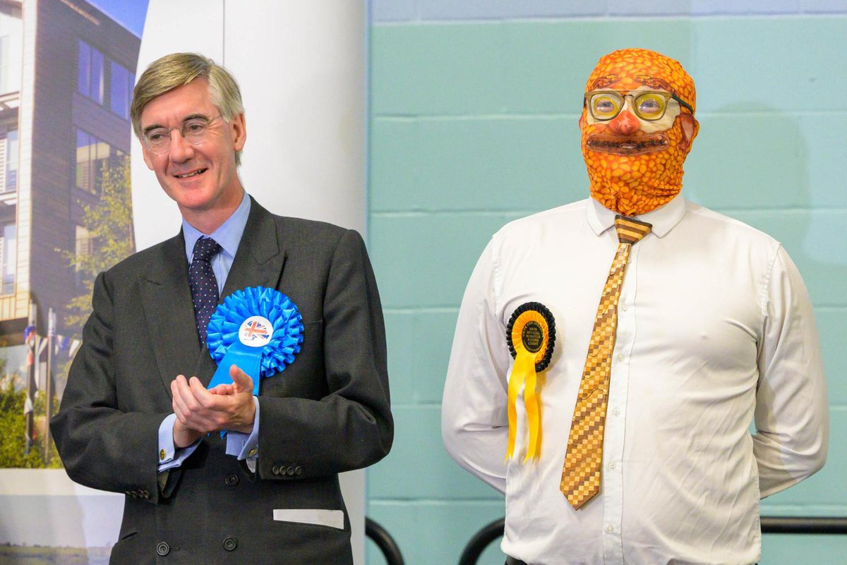 📸 Jacob Rees-Mogg pictured with Barmy Brunch from The Official Monster Raving Loony Party (wearing a baked beans balaclava) after losing his seat to Labour