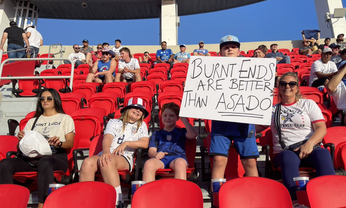nilram7's tweet photo. @MenInBlazers That’s our son taking the “burnt ends” poster board to the head. Left a dent (in the sign), but our daughter scooped it up and it made it to the @CopaAmerica 🇺🇸 v 🇺🇾 match at @GEHAField on Monday nite. #BurntEnds ◀️ #Asasdo https://t.co/zPa5ATtkll