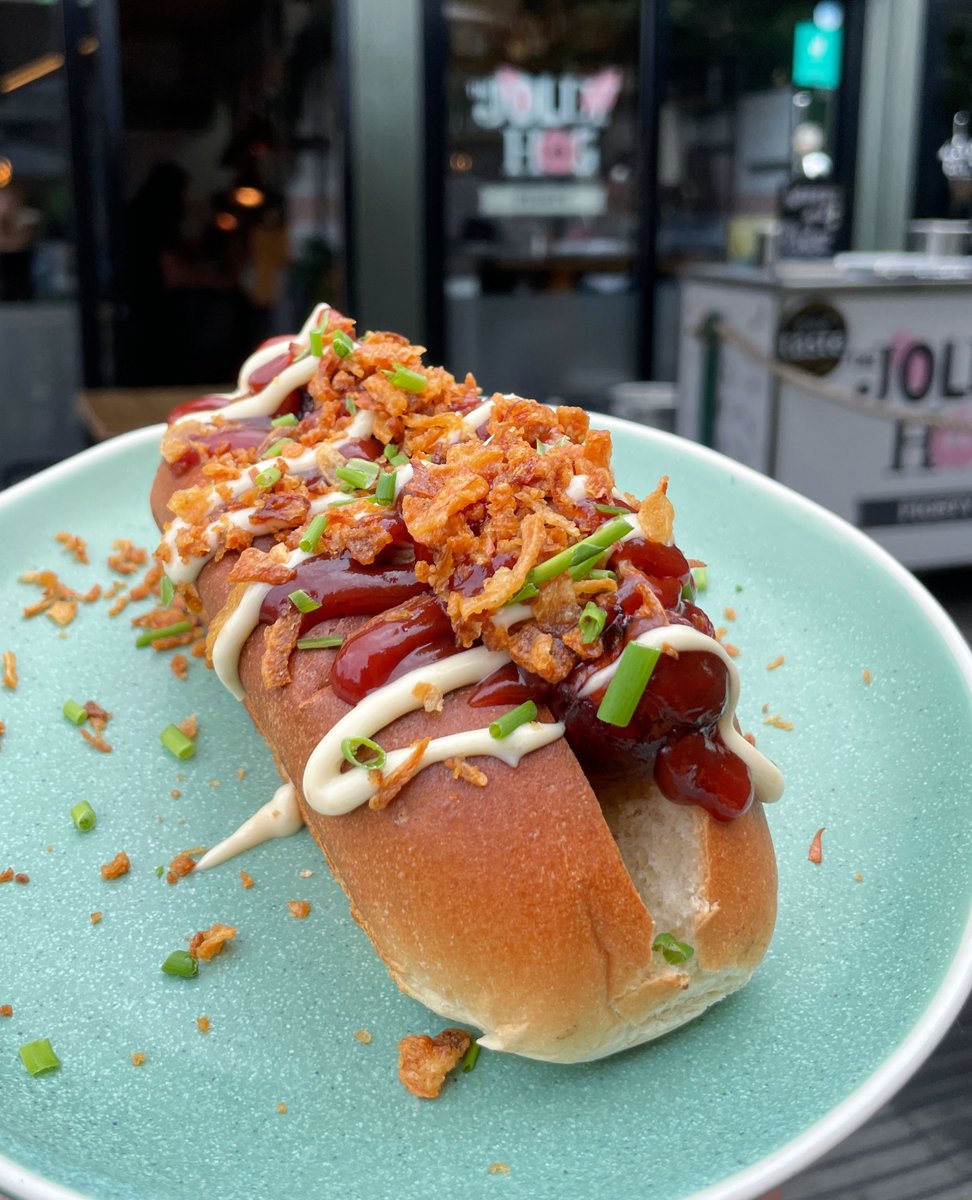 Our Smokey Dog 😮‍💨

Smokey Jolly Dog Sausage, pulled pork shoulder, chipotle honey ketchup, roast garlic mayo &amp; crispy onions for the crunchy goodness. 

Head to Wapping Wharf this weekend OR with the bad weather forecast don't forget we are also available on Deliveroo! 🛵