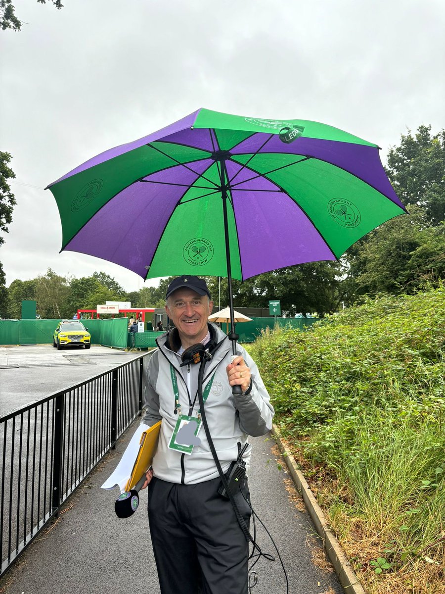 wimbledonradio's tweet photo. A little rain never hurt anyone 🌧 

We stopped by the Queue this morning &amp; @RobNothman soaked up the atmosphere as well as the rain! 🎾🙌

#Wimbledon https://t.co/OoHLWsrp7E