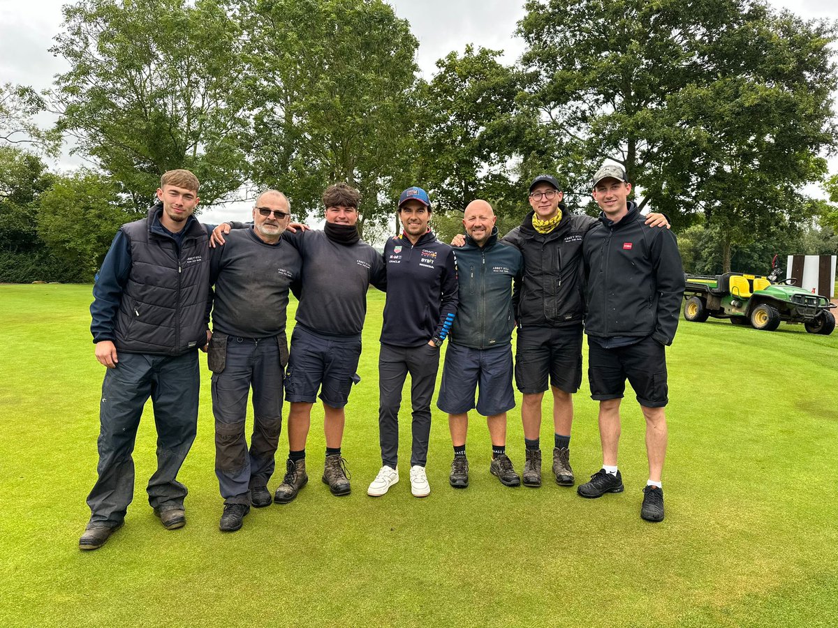 SN_1882's tweet photo. Nice for our Greenkeeping team to have a photo with @SChecoPerez at work this week whilst the Red Bull team visited Abbey Hill ⛳️ 🏎️ https://t.co/fHfbvj1V87