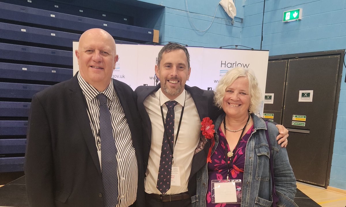HarlowLabour's tweet photo. Here's one for the history books...

from L to R, Bill Rammell (Labour MP for Harlow, 1997-2010), Chris Vince (Harlow's new Labour MP 2024), and Sarah Newens (Daughter of Stan Newens, MP for Harlow, 1974-1983) just after the declaration for Harlow at this mornings election count https://t.co/F2MhijVYTz