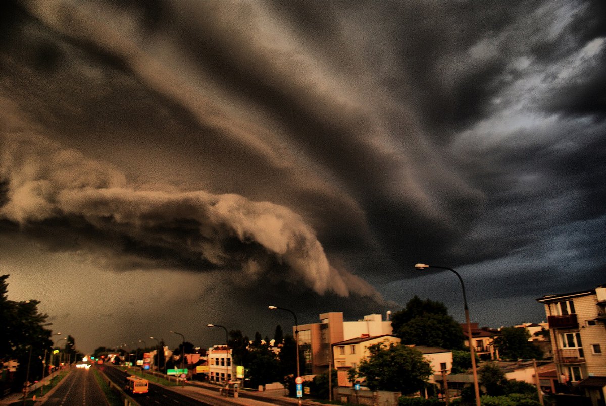Have you ever seen anything like this?

This both scary and fascinating view, captured by Dariusz Wierzbicki, refers to a dramatic shelf cloud, seen over Warsaw on 5 July 2009.

A shelf cloud is one of two main types of arcus clouds.
Precisely it is a low, horizontal,