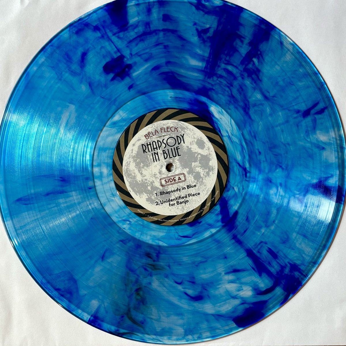 CMoneyKS's tweet photo. Super excited to finally get this @belafleckbanjo #RhapsodyInBlue on the cool blue swirly blue vinyl, sounds amazing. #Gershwin #Banjo #RhapsodyInBluegrass #RhapsodyInBlues #Bluegrass #VirginiaSymphonyOrchestra @sierrahull @VictorWooten #SamBush https://t.co/vknAtmT6ky