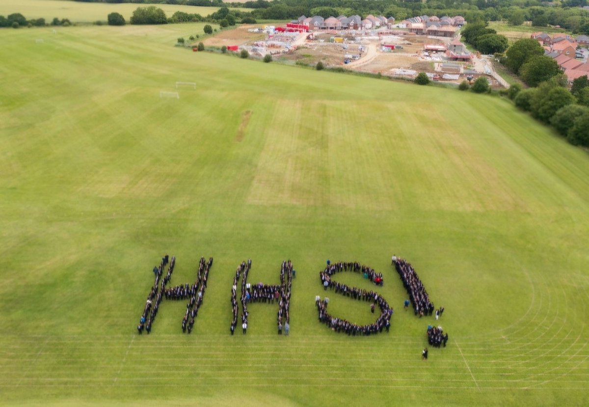 HarrogateHigh's tweet photo. CARES Community Day. 
On Wednesday the whole school worked together as a community around the theme of self-control (one of our CARES values). The day had a wonderful conclusion, with all the school showing self-control to gather on the field and create an aerial image HHS! https://t.co/znAHDZYaA9