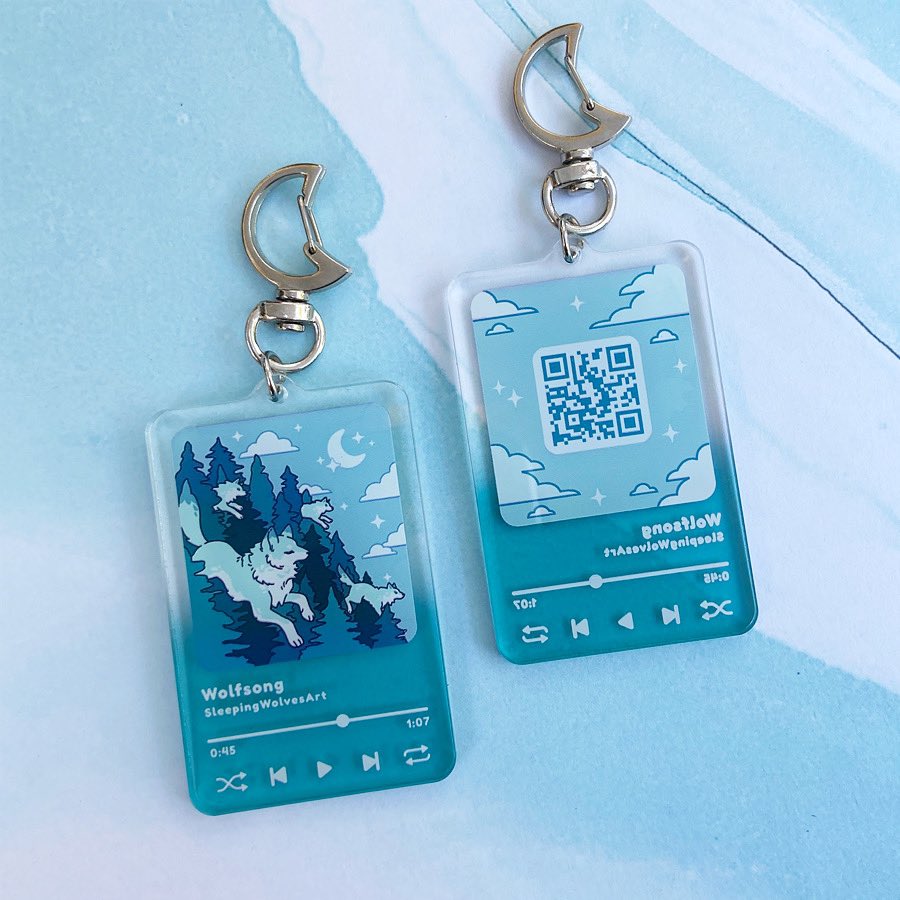 Wolfsong Acrylic Charms!🐺✨
You can listen to our musicbox theme, composed by the talented <a href="/miyolophone/">miyo (｡•̀ᴗ-)✧</a> , by scanning the QR code on the back! We wanted to make these charms functional as well as cute~☺️ 

🎶Listen here:🎶
on.soundcloud.com/XvYoWzCRjwj27i…