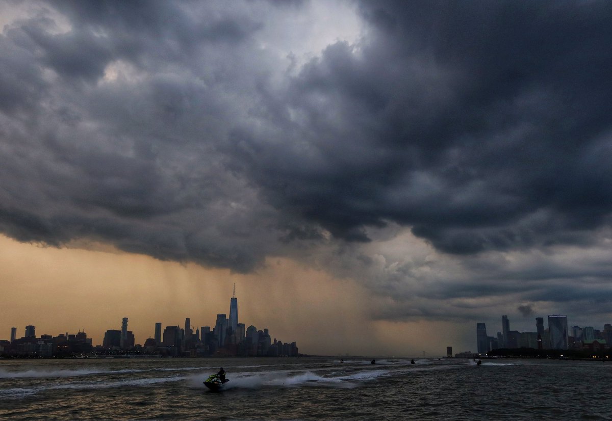 A rain shear passes behind lower Manhattan and One World Trade Center as a storm passes through New York City before sunset, Friday evening #newyork #newyorkcity #nyc #storm
