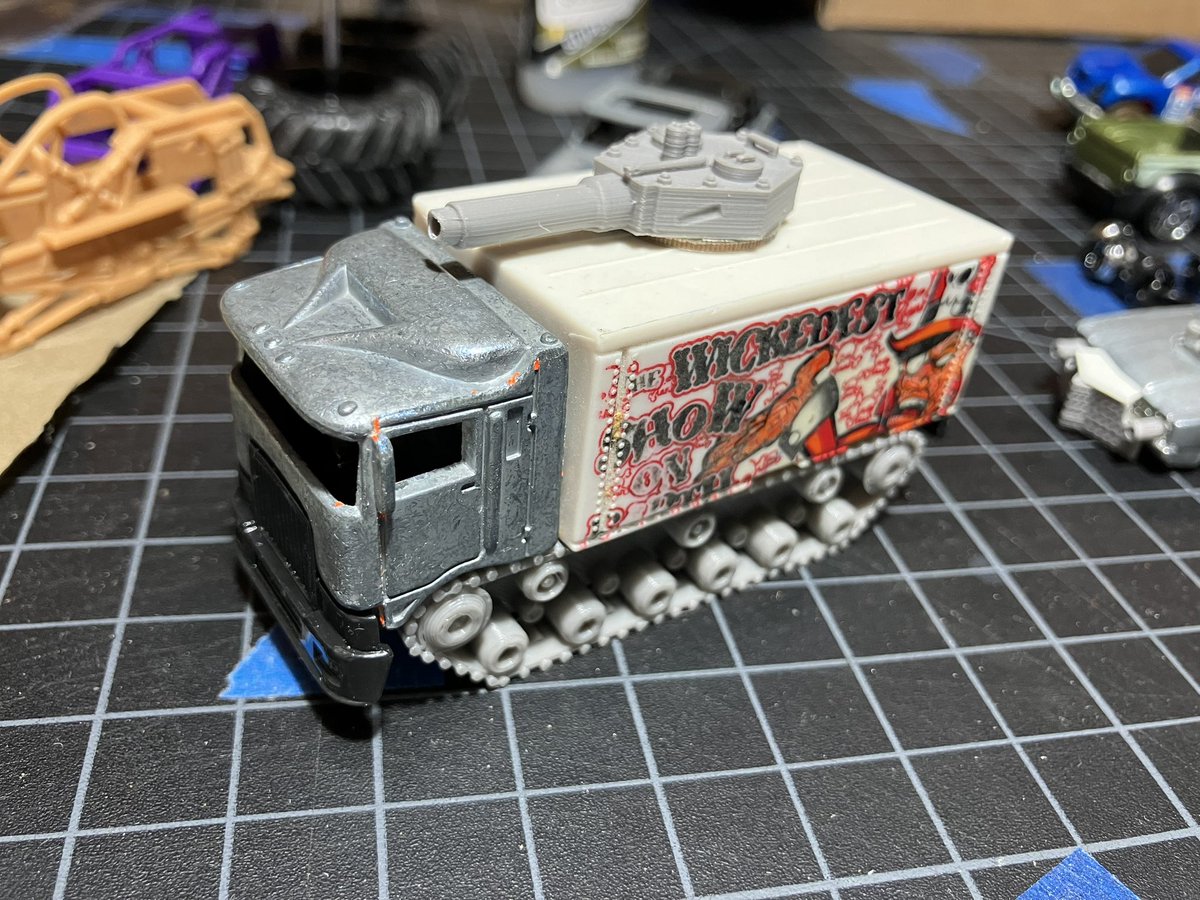 Lionofflanders's tweet photo. So here’s some more Gaslands progress: This box truck with tank treads and a gun turret. The original design on the truck box was too good to remove! https://t.co/s86s7e6CSF