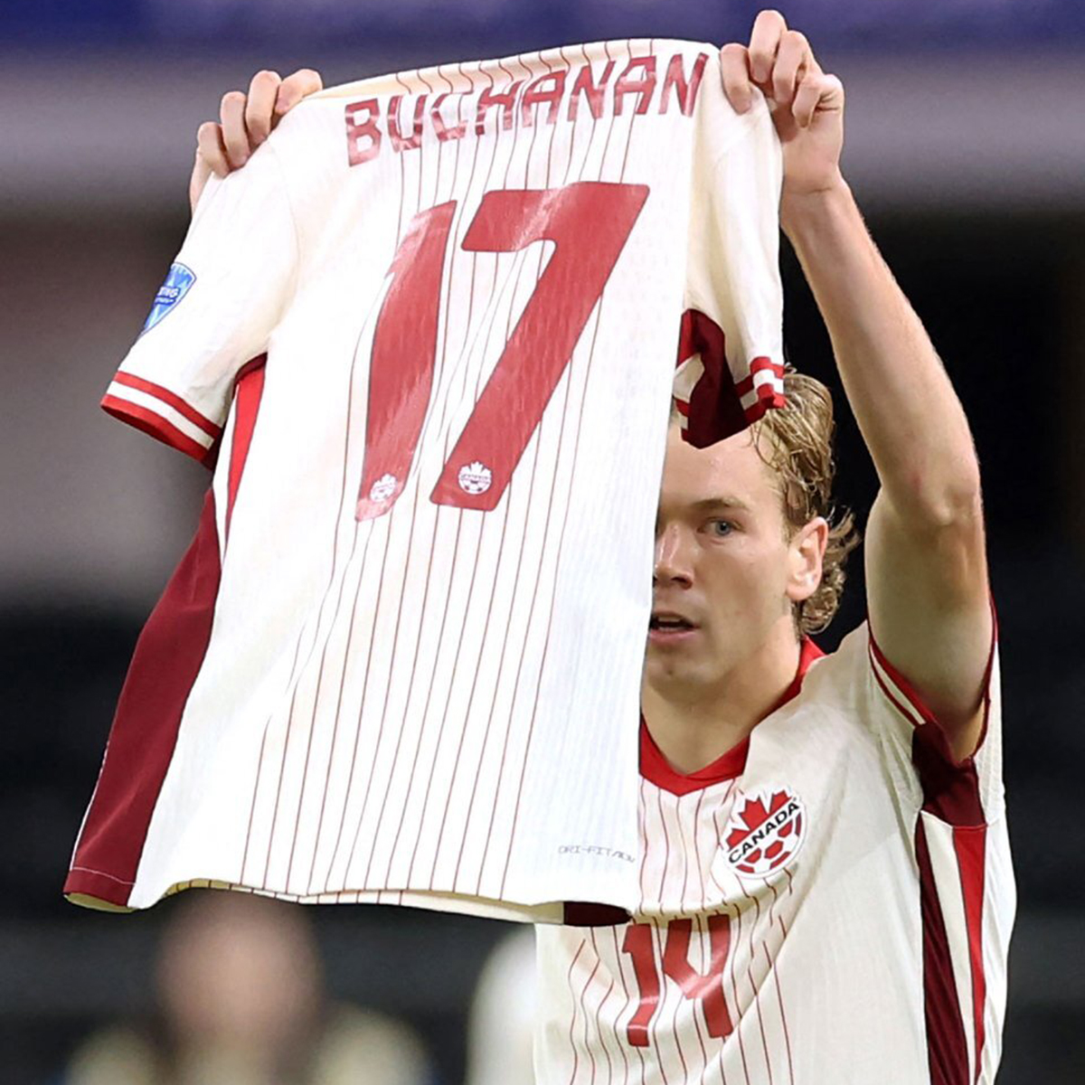 MenInBlazers's tweet photo. Amazing Moment as Jacob Shaffelburg holds up Tajon Buchanan's shirt after scoring the opening goal in Canada's Copa America quarter final against Venezuela. Buchanan suffered a broken leg in training on Monday. 🇨🇦❤️