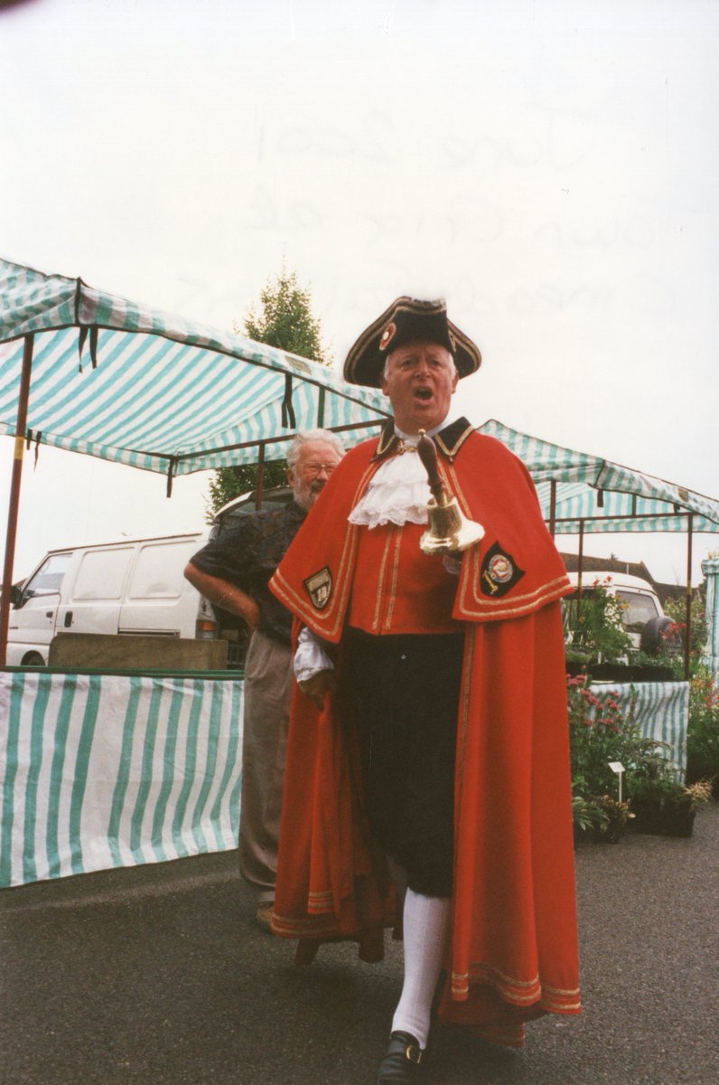 Today is #internationaltowncrierday, celebrating the lost role of the Town Crier. This photo is of a Town Crier visiting a market next to Chequer Mead in 2001.

Perhaps he was calling out the best bargains to everyone?