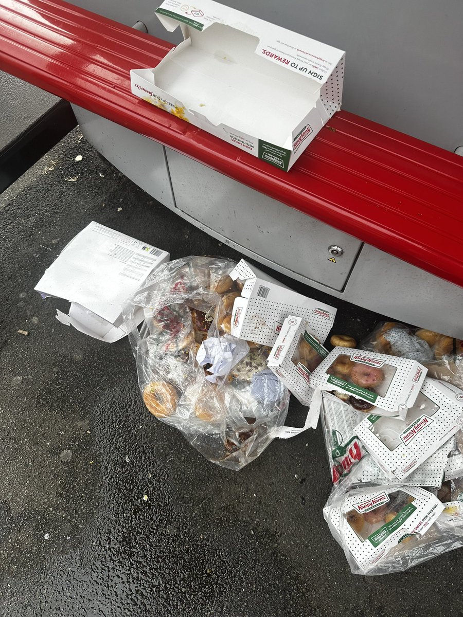 CatherineShir's tweet photo. @krispykremeUK This rubbish was dumped at a bus stop outside the New Malden drive thru. Seems like it came direct from the shop. Not acceptable. https://t.co/64Y3xZIpQj